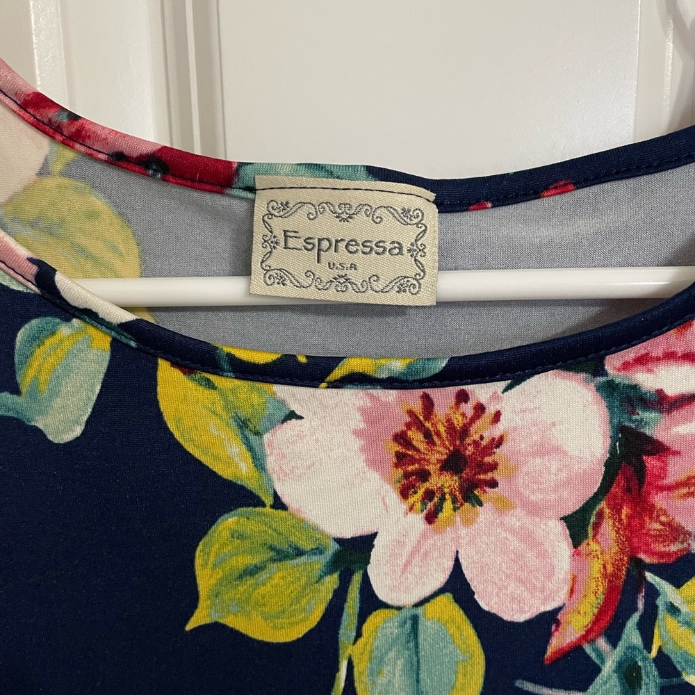 New without tags, navy floral cold shoulder float top. M/L